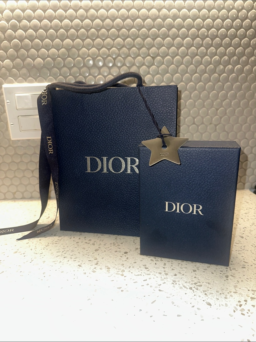 Dior bag box ribbon and star ready for gifting